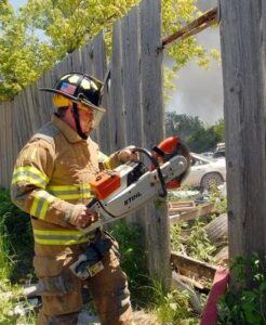 Firefighter using the jaws of life