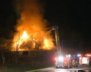 ladder truck putting out a house blaze